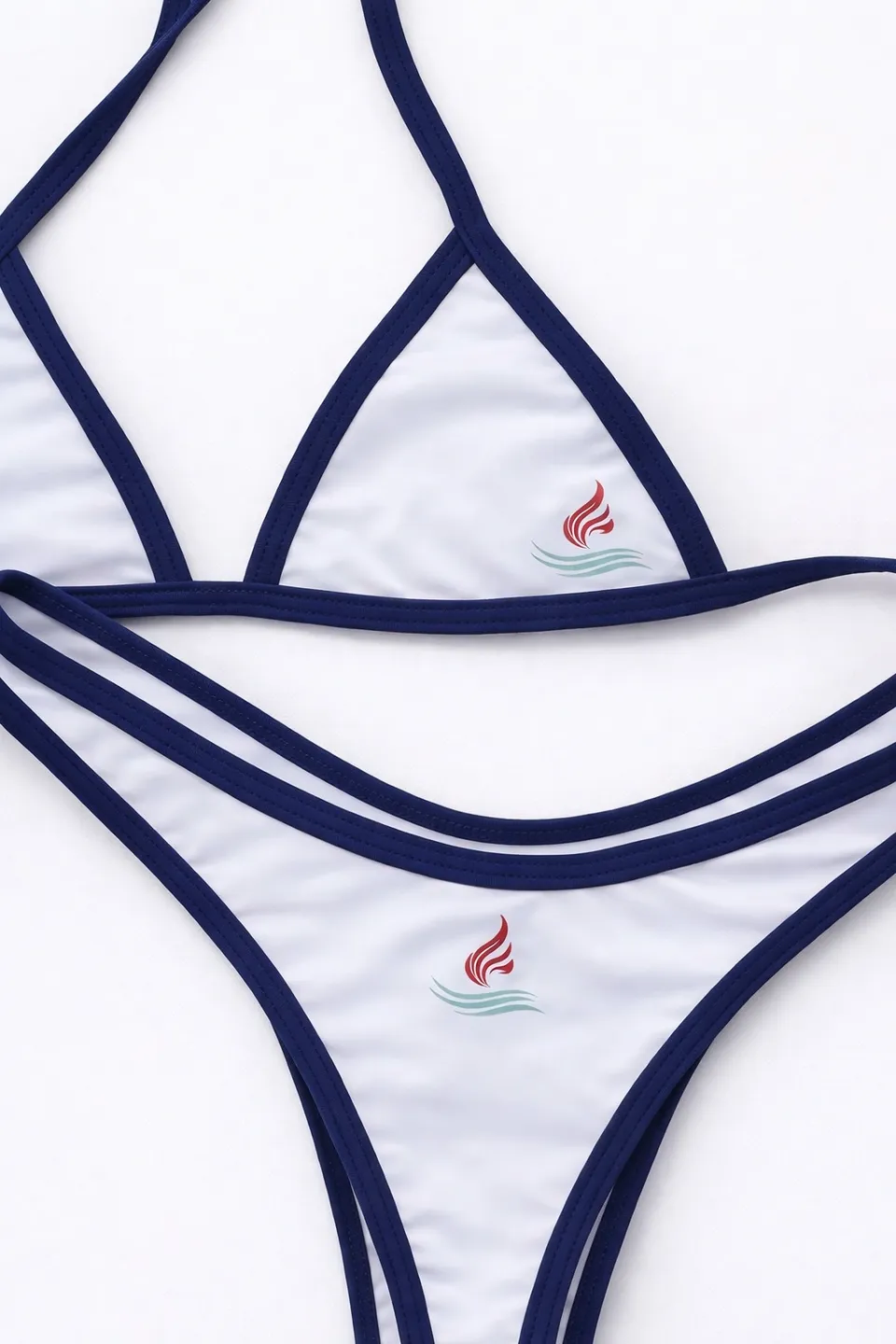 White bikini set with navy blue trim and small red logo detail.