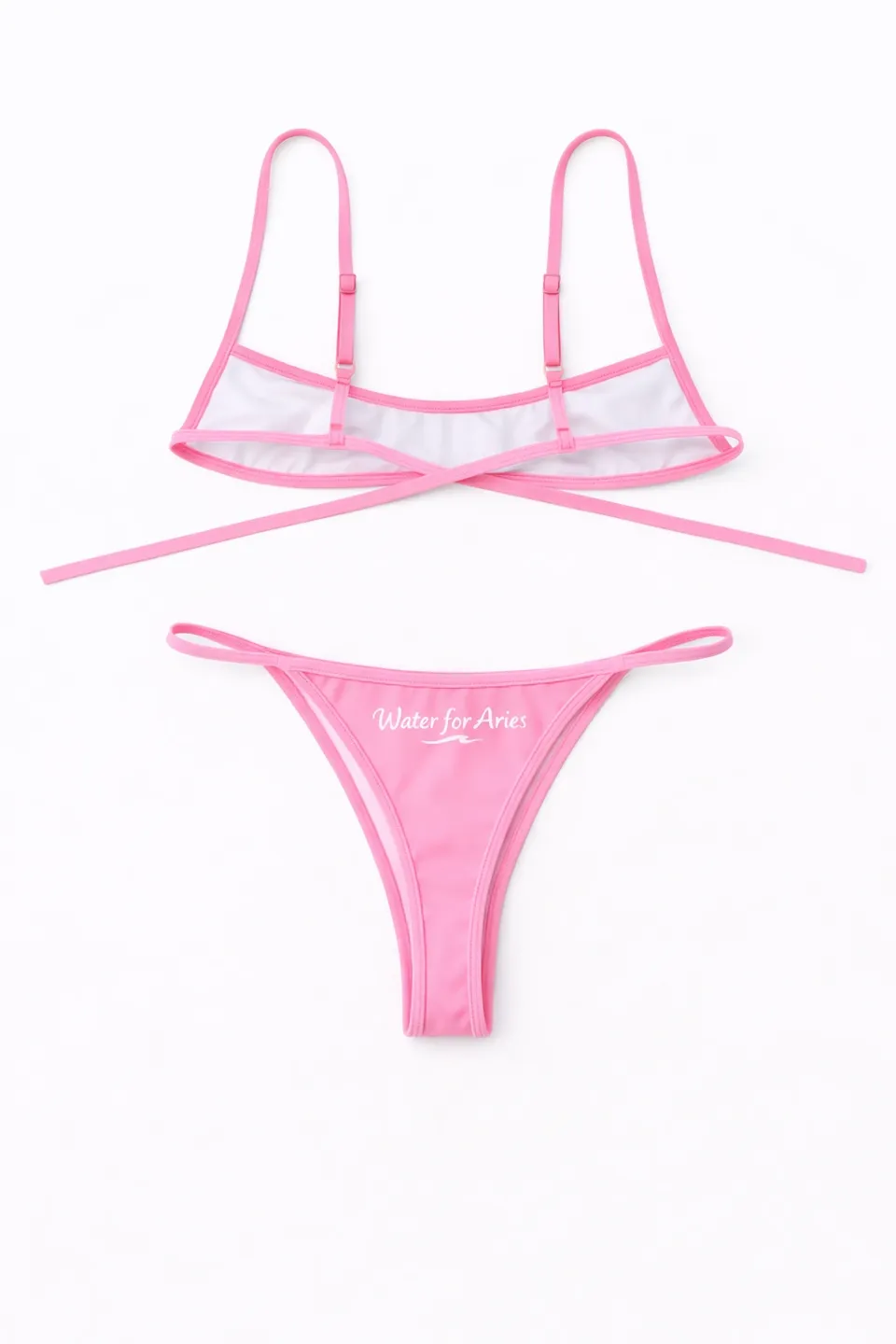 Pink sheer lingerie set with delicate straps and a thong bottom.
