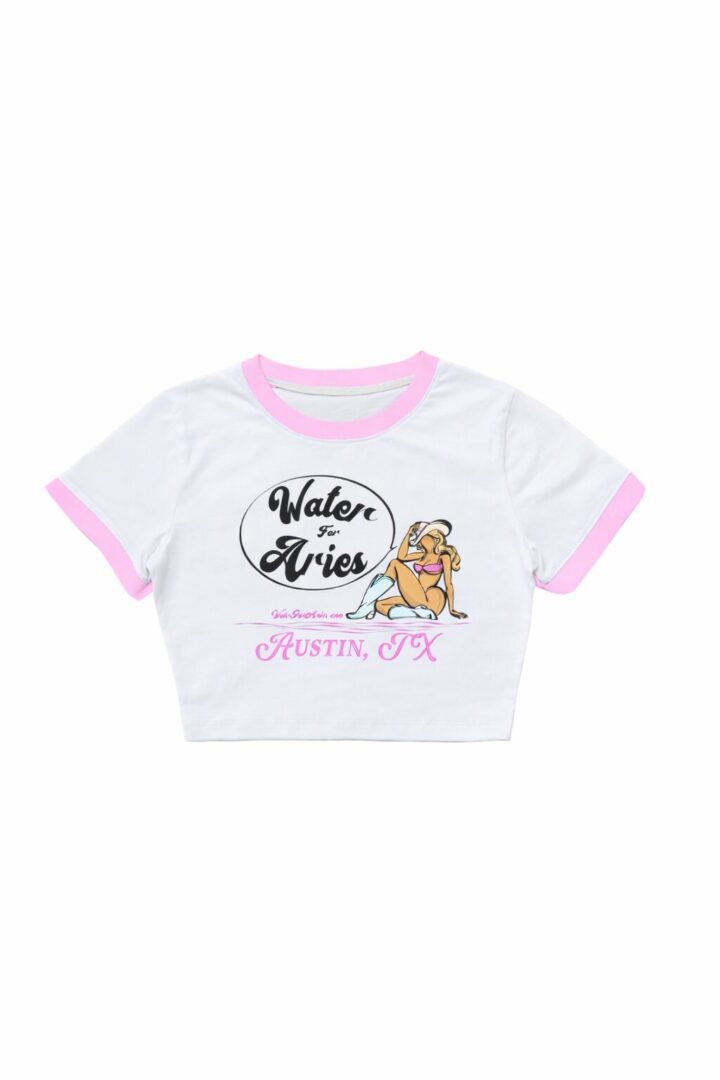 White crop top with pink trim and playful graphic design.