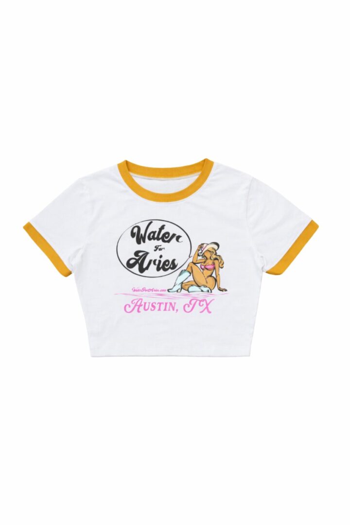 White crop top with yellow trim and floral 'Relax Vibes' print.